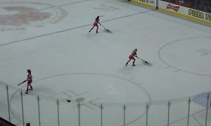 Cheerleaders pushing shovels